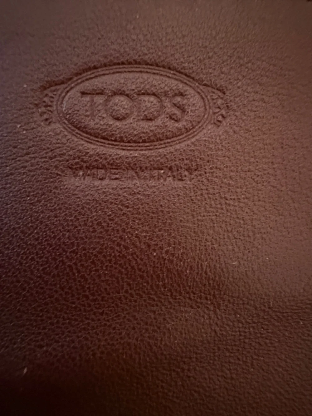 Tod's Brown Leather Continental Wallet with Gold Grommets